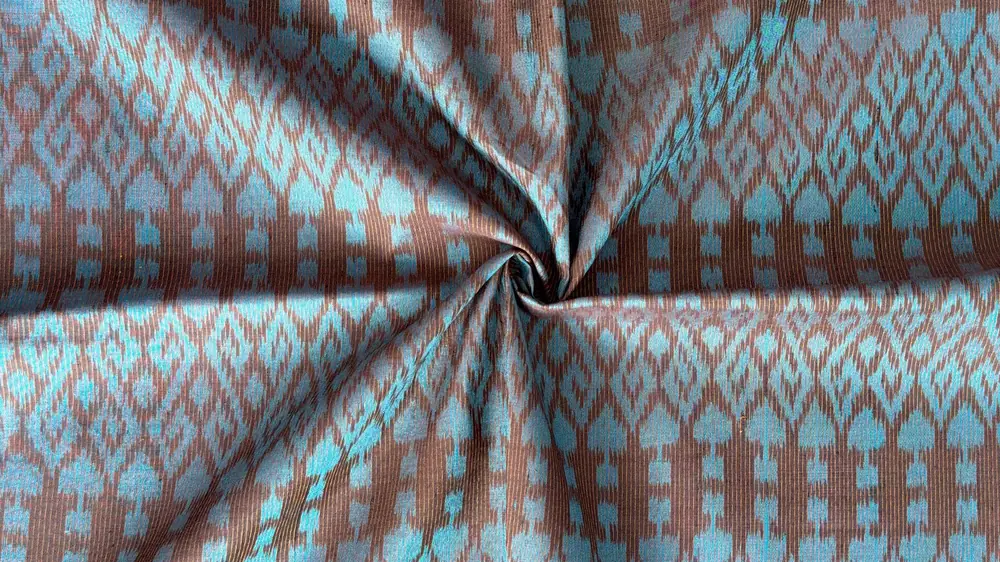 Close-up of genuine Thai silk showing two-tone sheen and texture