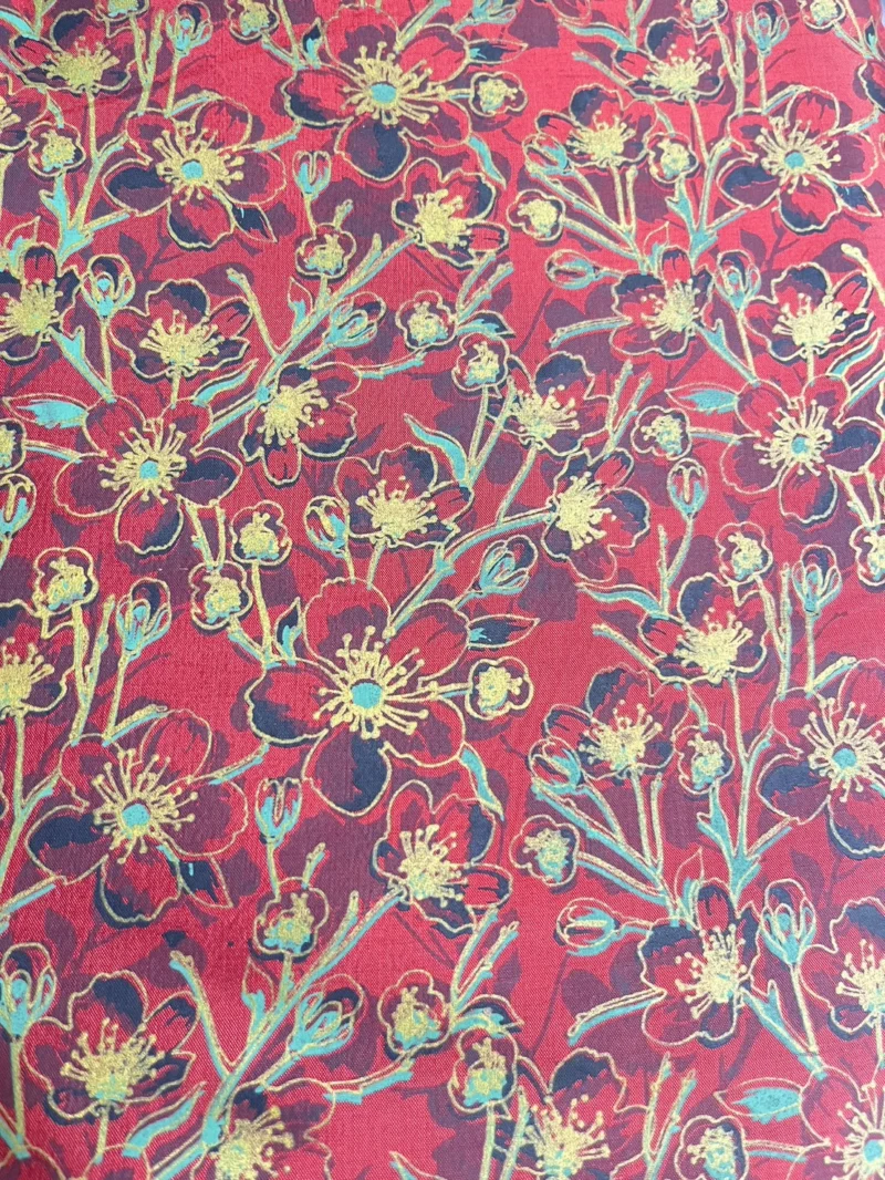 Printed silk with a floral design on red